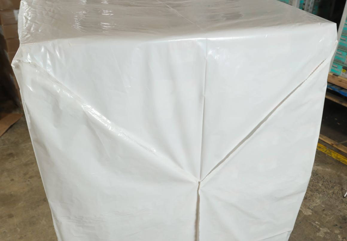 a container wrapped with a yseal cover wrap.